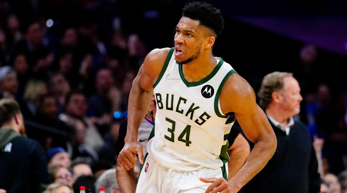 Milwaukee Bucks’ Giannis Antetokounmpo reacts after making a basket during the second half of an NBA basketball game against the Philadelphia 76ers, Tuesday, March 29, 2022, in Philadelphia.